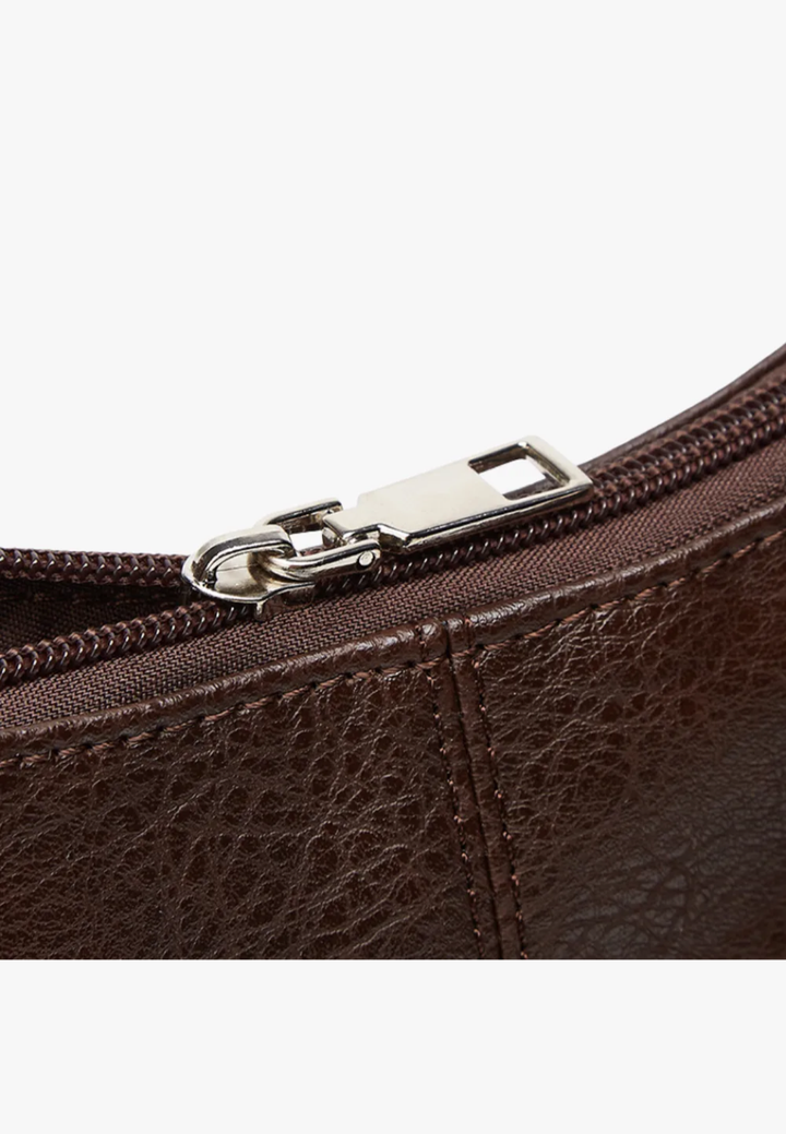 Damesschoudertas in leerlook met korte hengsels